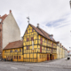 Den ejendom, hvori “Håndværkerhuset i Aalborg” siden 1984 har haft til huse, rummer bygningsdele tilbage til omkring 1630. Ejendommens storhedstid faldt omkring 1800, da ejeren Oluf Christensen fik indtægter fra både tobaks-, sæbe-, papir- og klædefabrikation og samtidig var såvel storkøbmand som skibsreder. Kattesundet 20, Aalborg.